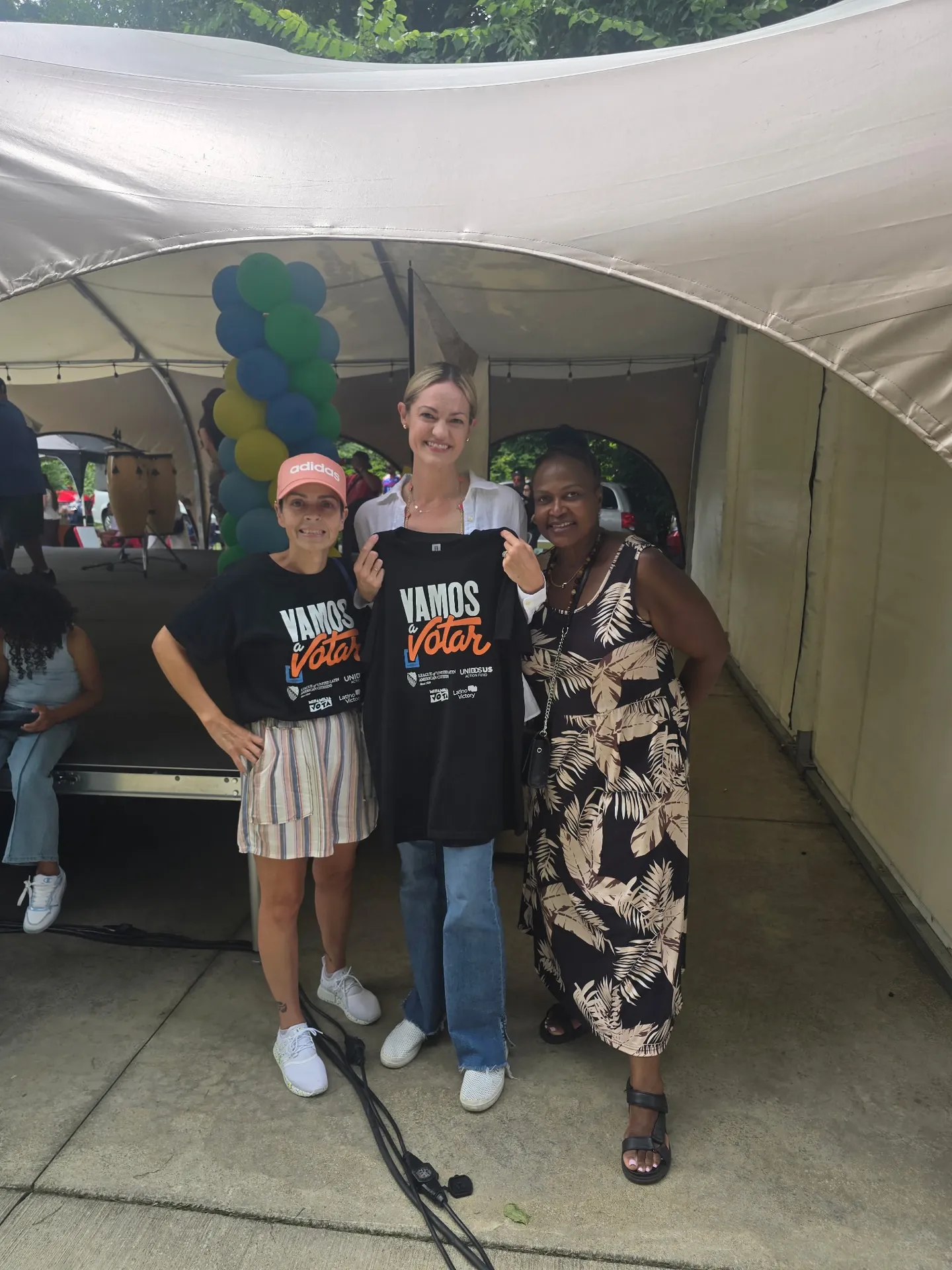 Volunteers with Vamos a Votar shirts at a community festival